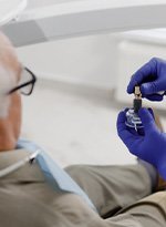 a patient visiting his dentist for dental implants