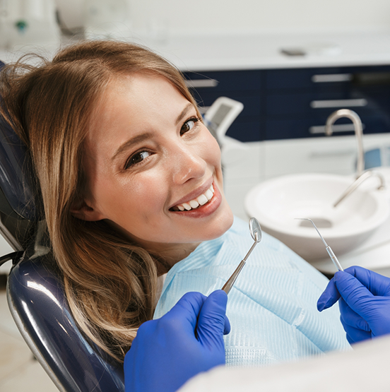 Woman smiling right before a dental exam
