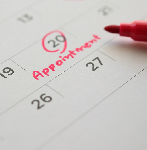 Date of a dental appointment circled on a calendar