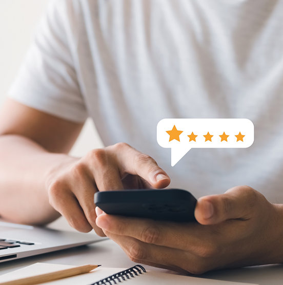 Person leaving a five star review on their phone